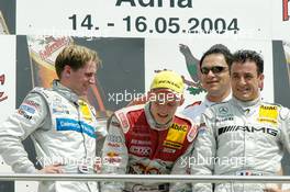 16.05.2004 Adria, Italy,  DTM, Sunday, Podium, with a very tired Mattias Ekström (SWE), Audi Sport Team Abt, Portrait (1st, center), Christijan Albers (NED), DaimlerChrysler Bank AMG-Mercedes, Portrait (2nd, left) and Jean Alesi (FRA), AMG-Mercedes, Portrait (3rd, left). In the background Hans-Jurgen Abt (GER), Teamchef Abt-Audi - DTM Season 2004 at Adria International Raceway (Deutsche Tourenwagen Masters, Italy)