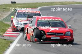 16.05.2004 Adria, Italy,  DTM, Sunday, Heinz-Harald Frentzen (GER), OPC Team Holzer, Opel Vectra GTS V8, lost a big part of the body work after hitting one of the tyre barriers in the chicane while in close battle with Bernd Schneider (GER), Vodafone AMG-Mercedes, AMG-Mercedes C-Klasse - DTM Season 2004 at Adria International Raceway (Deutsche Tourenwagen Masters, Italy)