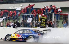 19.09.2004 Brno, Czech Republic,  DTM, Sunday, Mattias Ekström (SWE), Audi Sport Team Abt, Audi A4 DTM, passing his team after the finish of the race with a lot of wheelspin to celebrate his 2004 DTM championship - DTM Season 2004 at Automotodrom Brno, Czech Republic (Deutsche Tourenwagen Masters)