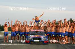 19.09.2004 Brno, Czech Republic,  DTM, Sunday, Audi group picture to celebrate the 2004 DTM championship of Mattias Ekström (SWE), Audi Sport Team Abt (center), with all team members including all drivers and team management, almost naked, just with shorts - DTM Season 2004 at Automotodrom Brno, Czech Republic (Deutsche Tourenwagen Masters)