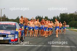 19.09.2004 Brno, Czech Republic,  DTM, Sunday, Audi group picture to celebrate the 2004 DTM championship of Mattias Ekström (SWE), Audi Sport Team Abt (center), with all team members including all drivers and team management, almost naked, just with shorts - DTM Season 2004 at Automotodrom Brno, Czech Republic (Deutsche Tourenwagen Masters)