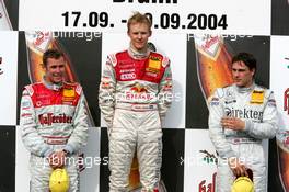 19.09.2004 Brno, Czech Republic,  DTM, Sunday, Podium, Mattias Ekström (SWE), Audi Sport Team Abt, Portrait (1st, center), Tom Kristensen (DNK), Audi Sport Team Abt Sportsline, Portrait (2nd, left) and Gary Paffett (GBR), C-Klasse AMG-Mercedes, Portrait (3rd, right) - DTM Season 2004 at Automotodrom Brno, Czech Republic (Deutsche Tourenwagen Masters)