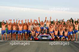 19.09.2004 Brno, Czech Republic,  DTM, Sunday, Audi group picture to celebrate the 2004 DTM championship of Mattias Ekström (SWE), Audi Sport Team Abt (center), with all team members including all drivers and team management, almost naked, just with shorts - DTM Season 2004 at Automotodrom Brno, Czech Republic (Deutsche Tourenwagen Masters)