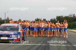 19.09.2004 Brno, Czech Republic,  DTM, Sunday, Audi group picture to celebrate the 2004 DTM championship of Mattias Ekström (SWE), Audi Sport Team Abt (center), with all team members including all drivers and team management, almost naked, just with shorts - DTM Season 2004 at Automotodrom Brno, Czech Republic (Deutsche Tourenwagen Masters)