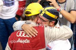 19.09.2004 Brno, Czech Republic,  DTM, Sunday, Christian Abt (GER), Audi Sport Team Abt Sportsline, congratulates Mattias Ekström (SWE), Audi Sport Team Abt, with his 2004 DTM championship - DTM Season 2004 at Automotodrom Brno, Czech Republic (Deutsche Tourenwagen Masters)