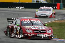 19.09.2004 Brno, Czech Republic,  DTM, Sunday, Stefan Mücke (GER), CLK AMG-Mercedes, Mercedes CLK-DTM, in front of Bernd Schneider (GER), Vodafone AMG-Mercedes, AMG-Mercedes C-Klasse - DTM Season 2004 at Automotodrom Brno, Czech Republic (Deutsche Tourenwagen Masters)