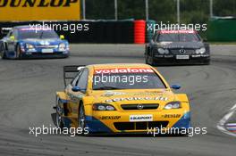 19.09.2004 Brno, Czech Republic,  DTM, Sunday, Jeroen Bleekemolen (NED), OPC Euroteam, Opel Astra V8 Coupé, in front of Bernd Mayländer (GER), CLK AMG-Mercedes, Mercedes CLK-DTM and Manuel Reuter (GER), OPC Team Holzer, Opel Vectra GTS V8 - DTM Season 2004 at Automotodrom Brno, Czech Republic (Deutsche Tourenwagen Masters)