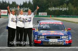 19.09.2004 Brno, Czech Republic,  DTM, Sunday, Audi group picture with new 2004 DTM champion Mattias Ekström (SWE), Audi Sport Team Abt, Audi A4 DTM (center), Hans-Jurgen Abt (GER), Teamchef Abt-Audi (left) and Dr. Wolfgang Ullrich (GER), Audi's Head of Sport (right) - DTM Season 2004 at Automotodrom Brno, Czech Republic (Deutsche Tourenwagen Masters)