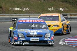 19.09.2004 Brno, Czech Republic,  DTM, Sunday, Manuel Reuter (GER), OPC Team Holzer, Opel Vectra GTS V8, in front of Jeroen Bleekemolen (NED), OPC Euroteam, Opel Astra V8 Coupé - DTM Season 2004 at Automotodrom Brno, Czech Republic (Deutsche Tourenwagen Masters)