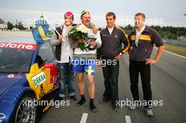 19.09.2004 Brno, Czech Republic,  DTM, Sunday, Opel drivers Timo Scheider (GER), OPC Team Holzer (left), Jeroen Bleekemolen (NED), OPC Euroteam (center), and Marcel Fässler (SUI), OPC Team Phoenix (right) come to congratulate Mattias Ekström (SWE), Audi Sport Team Abt, with his 2004 DTM championship - DTM Season 2004 at Automotodrom Brno, Czech Republic (Deutsche Tourenwagen Masters)