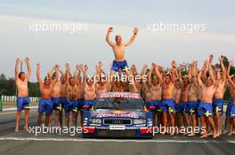 19.09.2004 Brno, Czech Republic,  DTM, Sunday, Audi group picture to celebrate the 2004 DTM championship of Mattias Ekström (SWE), Audi Sport Team Abt (center), with all team members including all drivers and team management, almost naked, just with shorts - DTM Season 2004 at Automotodrom Brno, Czech Republic (Deutsche Tourenwagen Masters)