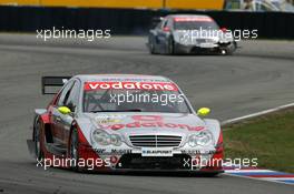 19.09.2004 Brno, Czech Republic,  DTM, Sunday, Bernd Schneider (GER), Vodafone AMG-Mercedes, AMG-Mercedes C-Klasse, in front of Christijan Albers (NED), DaimlerChrysler Bank AMG-Mercedes, AMG-Mercedes C-Klasse - DTM Season 2004 at Automotodrom Brno, Czech Republic (Deutsche Tourenwagen Masters)