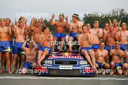 19.09.2004 Brno, Czech Republic,  DTM, Sunday, Audi group picture to celebrate the 2004 DTM championship of Mattias Ekström (SWE), Audi Sport Team Abt (center), with all team members including all drivers and team management, almost naked, just with shorts - DTM Season 2004 at Automotodrom Brno, Czech Republic (Deutsche Tourenwagen Masters)