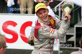 19.09.2004 Brno, Czech Republic,  DTM, Sunday, Mattias Ekström (SWE), Audi Sport Team Abt, Portrait, spraying champaign to his team after the podium ceremony - DTM Season 2004 at Automotodrom Brno, Czech Republic (Deutsche Tourenwagen Masters)