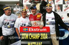 19.09.2004 Brno, Czech Republic,  DTM, Sunday, Newly crowned 2004 DTM champion Mattias Ekström (SWE), Audi Sport Team Abt, Portrait, with his father, mother and his closest friend - DTM Season 2004 at Automotodrom Brno, Czech Republic (Deutsche Tourenwagen Masters)