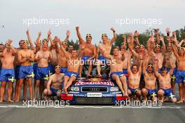 19.09.2004 Brno, Czech Republic,  DTM, Sunday, Audi group picture to celebrate the 2004 DTM championship of Mattias Ekström (SWE), Audi Sport Team Abt (center), with all team members including all drivers and team management, almost naked, just with shorts - DTM Season 2004 at Automotodrom Brno, Czech Republic (Deutsche Tourenwagen Masters)