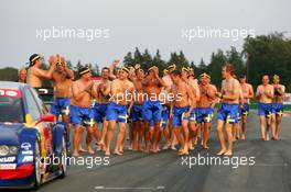 19.09.2004 Brno, Czech Republic,  DTM, Sunday, Audi group picture to celebrate the 2004 DTM championship of Mattias Ekström (SWE), Audi Sport Team Abt (center), with all team members including all drivers and team management, almost naked, just with shorts - DTM Season 2004 at Automotodrom Brno, Czech Republic (Deutsche Tourenwagen Masters)