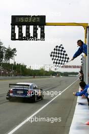 19.09.2004 Brno, Czech Republic,  DTM, Sunday, Mattias Ekström (SWE), Audi Sport Team Abt, Audi A4 DTM, taking the checkered flag to win the race and the 2004 DTM championship - DTM Season 2004 at Automotodrom Brno, Czech Republic (Deutsche Tourenwagen Masters)