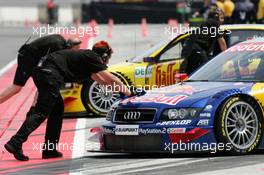 04.06.2004 Klettwitz, Germany,  DTM, Friday, Audi mechanics push the cars of Martin Tomczyk (GER), Audi Sport Team Abt, Audi A4 DTM, and Christian Abt (GER), Audi Sport Team Abt Sportsline, Audi A4 DTM, back into the pitbox - DTM Season 2004 at Lausitzring (Deutsche Tourenwagen Masters)