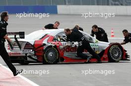 04.06.2004 Klettwitz, Germany,  DTM, Friday, Mercdes mechanics push the car of Bernd Schneider (GER), Vodafone AMG-Mercedes, AMG-Mercedes C-Klasse, back into the pits - DTM Season 2004 at Lausitzring (Deutsche Tourenwagen Masters)