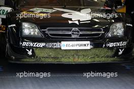 05.06.2004 Klettwitz, Germany,  DTM, Saturday, Grass on the car of Laurent Aiello (FRA), OPC Team Phoenix, Opel Vectra GTS V8, after an off-track excursion - DTM Season 2004 at Lausitzring (Deutsche Tourenwagen Masters)