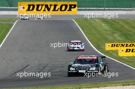 06.06.2004 Klettwitz, Germany,  DTM, Sunday, Gary Paffett (GBR), C-Klasse AMG-Mercedes, AMG-Mercedes C-Klasse, leading in front of Mattias Ekström (SWE), Audi Sport Team Abt, Audi A4 DTM and (in the background), Christijan Albers (NED), DaimlerChrysler Bank AMG-Mercedes, AMG-Mercedes C-Klasse and Bernd Schneider (GER), Vodafone AMG-Mercedes, AMG-Mercedes C-Klasse - DTM Season 2004 at Lausitzring (Deutsche Tourenwagen Masters)