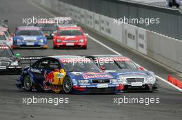 06.06.2004 Klettwitz, Germany,  DTM, Sunday, Start of the race with Christijan Albers (NED), DaimlerChrysler Bank AMG-Mercedes, AMG-Mercedes C-Klasse, staring from pole position but with Mattias Ekström (SWE), Audi Sport Team Abt, Audi A4 DTM, taking the lead in the first corner - DTM Season 2004 at Lausitzring (Deutsche Tourenwagen Masters)