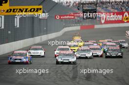 06.06.2004 Klettwitz, Germany,  DTM, Sunday, Start of the race with Christijan Albers (NED), DaimlerChrysler Bank AMG-Mercedes, AMG-Mercedes C-Klasse, staring from pole position but with Mattias Ekström (SWE), Audi Sport Team Abt, Audi A4 DTM, taking the lead in the first corner - DTM Season 2004 at Lausitzring (Deutsche Tourenwagen Masters)