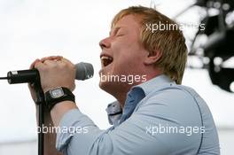 06.06.2004 Klettwitz, Germany,  DTM, Sunday, Kurt NIlsen (NOR), winner of World Idols, performing at the pre-race show during the pitwalk - DTM Season 2004 at Lausitzring (Deutsche Tourenwagen Masters)