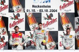 03.10.2004 Hockenheim, Germany,  DTM, Sunday, Podium, Bernd Schneider (GER), Vodafone AMG-Mercedes, Portrait (1st, center), Martin Tomczyk (GER), Audi Sport Team Abt, Portrait (2nd, left) and Gary Paffett (GBR), C-Klasse AMG-Mercedes, Portrait (3rd, right) - DTM Season 2004 at Hockenheimring Baden-Württemberg (Deutsche Tourenwagen Masters)