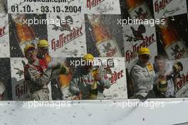 03.10.2004 Hockenheim, Germany,  DTM, Sunday, Podium, Martin Tomczyk (GER), Audi Sport Team Abt, Audi A4 DTM, Bernd Schneider (GER), Vodafone AMG-Mercedes, AMG-Mercedes C-Klasse, Mattias Ekström (SWE), Audi Sport Team Abt, Audi A4 DTM, Gary Paffett (GBR), C-Klasse AMG-Mercedes, AMG-Mercedes C-Klasse, Hans-Juergen Mattheis (GER), Team Manager HWA - DTM Season 2004 at Hockenheimring Baden-Württemberg (Deutsche Tourenwagen Masters, Deutschland)