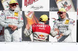 03.10.2004 Hockenheim, Germany,  DTM, Sunday, Podium, Mattias Ekström (SWE), Audi Sport Team Abt, Portrait, DTM Champion 2004, gets congratulations from Gary Paffett (GBR), C-Klasse AMG-Mercedes, Portrait (3rd) - DTM Season 2004 at Hockenheimring Baden-Württemberg (Deutsche Tourenwagen Masters)