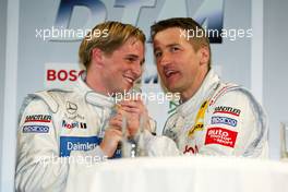 30.03.2004 Hamburg, Germany,  Christijan Albers (NED), DaimlerChrysler Bank AMG-Mercedes, Portrait, and Bernd Schneider (GER), Vodafone AMG-Mercedes, Portrait, already fighting about who is going to win the championship - DTM Presentation 2004, Rathausmarkt