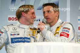 30.03.2004 Hamburg, Germany,  Christijan Albers (NED), DaimlerChrysler Bank AMG-Mercedes, Portrait, and Bernd Schneider (GER), Vodafone AMG-Mercedes, Portrait, already fighting about who is going to win the championship - DTM Presentation 2004, Rathausmarkt