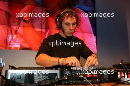 31.07.2004 Nürburg, Germany,  DTM, Saturday, Laurent Aiello (FRA), OPC Team Phoenix, Portrait, working as a DJ in the Opel hospitality unit on Saturday evening, mixing a good house set - DTM Season 2004 at Nürburgring (Deutsche Tourenwagen Masters)