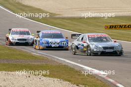 01.08.2004 Nürburg, Germany,  DTM, Sunday, Christijan Albers (NED), DaimlerChrysler Bank AMG-Mercedes, AMG-Mercedes C-Klasse, in front of Marcel Fässler (SUI), OPC Team Phoenix, Opel Vectra GTS V8 and Bernd Schneider (GER), Vodafone AMG-Mercedes, AMG-Mercedes C-Klasse - DTM Season 2004 at Nürburgring (Deutsche Tourenwagen Masters)