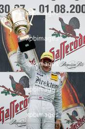 01.08.2004 Nürburg, Germany,  DTM, Sunday, Podium, race winner Gary Paffett (GBR), C-Klasse AMG-Mercedes, Portrait (1st), holding up the winners trophy - DTM Season 2004 at Nürburgring (Deutsche Tourenwagen Masters)