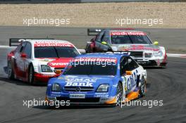 01.08.2004 Nürburg, Germany,  DTM, Sunday, Marcel Fässler (SUI), OPC Team Phoenix, Opel Vectra GTS V8, in front of Timo Scheider (GER), OPC Team Holzer, Opel Vectra GTS V8 and Bernd Schneider (GER), Vodafone AMG-Mercedes, AMG-Mercedes C-Klasse - DTM Season 2004 at Nürburgring (Deutsche Tourenwagen Masters)