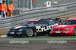 01.08.2004 Nürburg, Germany,  DTM, Sunday, Laurent Aiello (FRA), OPC Team Phoenix, Opel Vectra GTS V8, overtakes his teammate Heinz-Harald Frentzen (GER), OPC Team Holzer, Opel Vectra GTS V8 on the inside causing the latter to spin after the corner - DTM Season 2004 at Nürburgring (Deutsche Tourenwagen Masters)