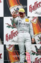 01.08.2004 Nürburg, Germany,  DTM, Sunday, Podium, Gary Paffett (GBR), C-Klasse AMG-Mercedes, Portrait (1st), showing it's his 5th win already this season, although 2 wins do not count (disqualification at Lausitzring and non-championship race in Shanghai) - DTM Season 2004 at Nürburgring (Deutsche Tourenwagen Masters)