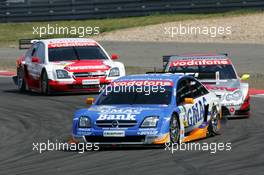 01.08.2004 Nürburg, Germany,  DTM, Sunday, Marcel Fässler (SUI), OPC Team Phoenix, Opel Vectra GTS V8, in front of Bernd Schneider (GER), Vodafone AMG-Mercedes, AMG-Mercedes C-Klasse and Timo Scheider (GER), OPC Team Holzer, Opel Vectra GTS V8 - DTM Season 2004 at Nürburgring (Deutsche Tourenwagen Masters)