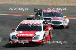 01.08.2004 Nürburg, Germany,  DTM, Sunday, Timo Scheider (GER), OPC Team Holzer, Opel Vectra GTS V8, in front of Bernd Schneider (GER), Vodafone AMG-Mercedes, AMG-Mercedes C-Klasse - DTM Season 2004 at Nürburgring (Deutsche Tourenwagen Masters)