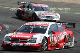 01.08.2004 Nürburg, Germany,  DTM, Sunday, Timo Scheider (GER), OPC Team Holzer, Opel Vectra GTS V8, in front of Bernd Schneider (GER), Vodafone AMG-Mercedes, AMG-Mercedes C-Klasse - DTM Season 2004 at Nürburgring (Deutsche Tourenwagen Masters)