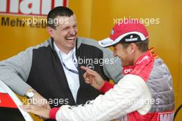25.06.2004 Nürnberg, Germany,  DTM, Friday, Günther Steiner (AUT), Technical Director Opel Performance DTM (left) sharing a joke with Timo Scheider (GER), OPC Team Holzer, Portrait (right) - DTM Season 2004 at Norisring (Deutsche Tourenwagen Masters)