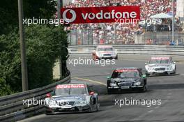 27.06.2004 Nürnberg, Germany,  DTM, Sunday, Christijan Albers (NED), DaimlerChrysler Bank AMG-Mercedes, AMG-Mercedes C-Klasse, leading the race in front of Gary Paffett (GBR), C-Klasse AMG-Mercedes, AMG-Mercedes C-Klasse, Jean Alesi (FRA), AMG-Mercedes, AMG-Mercedes C-Klasse and Bernd Schneider (GER), Vodafone AMG-Mercedes, AMG-Mercedes C-Klasse - DTM Season 2004 at Norisring (Deutsche Tourenwagen Masters)