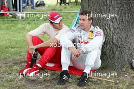 27.06.2004 Nürnberg, Germany,  DTM, Sunday, Timo Scheider (GER), OPC Team Holzer, Portrait (left) and Bernd Schneider (GER), Vodafone AMG-Mercedes, Portrait (right), talking before the race - DTM Season 2004 at Norisring (Deutsche Tourenwagen Masters)