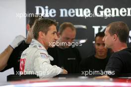 07.08.2004 Oschersleben, Germany,  DTM, Saturday, Bernd Schneider (GER), Vodafone AMG-Mercedes, Portrait (left), chatting with his mechanics - DTM Season 2004 at Motopark Oschersleben (Deutsche Tourenwagen Masters)