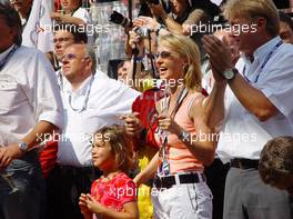 08.08.2004 Oschersleben, Germany,  DTM, Sunday, Wife of Manuel Reuter (GER), OPC Team Holzer, and his daughter during the podium ceremony - DTM Season 2004 at Motopark Oschersleben (Deutsche Tourenwagen Masters)