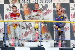 08.08.2004 Oschersleben, Germany,  DTM, Sunday, Podium, Tom Kristensen (DNK), Audi Sport Team Abt Sportsline, Portrait (1st, center), Martin Tomczyk (GER), Audi Sport Team Abt, Portrait (2nd, left) and Manuel Reuter (GER), OPC Team Holzer, Portrait (3rd, right) - DTM Season 2004 at Motopark Oschersleben (Deutsche Tourenwagen Masters)