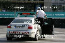 18.07.2004 Shanghai, China,  DTM, Sunday, DMSB official driving aroung in the DTM safety car to check all manhole covers to check if they were welded properly - DTM Season 2004 at Pu Dong Street Circuit Shanghai (Deutsche Tourenwagen Masters)